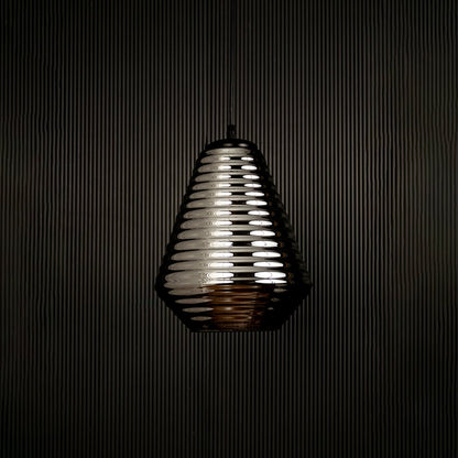 Smoked ribbed glass pendant light displayed on dark background with light off highlighting its elegant form and premium finish.