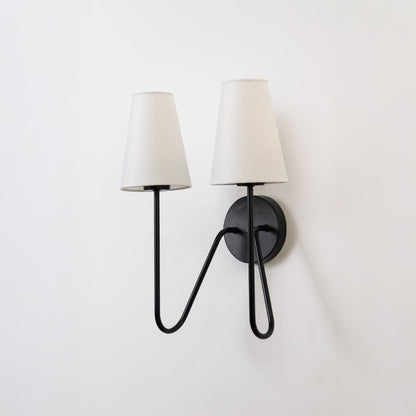 Stylish black double wall light with twin white shades displayed on a white background ideal for bedroom hallway or living room lighting.