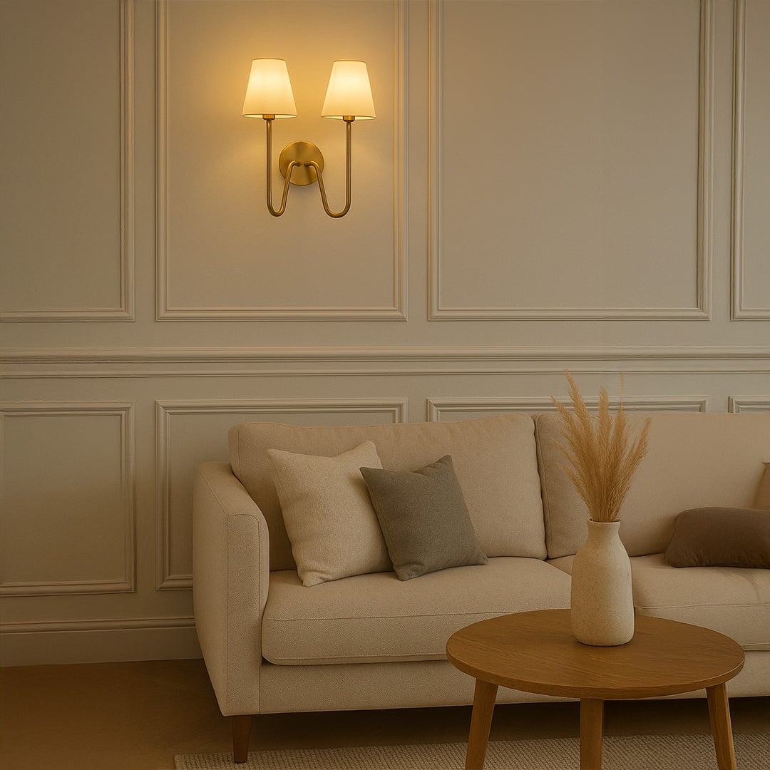 Modern double wall light with gold metal frame and twin white shades adding warm style to bedroom hallway or living space decor.