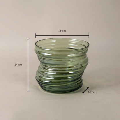Green ribbed glass vase with a unique wavy structure measuring 14 cm tall and 16 cm wide displayed with dimensions.