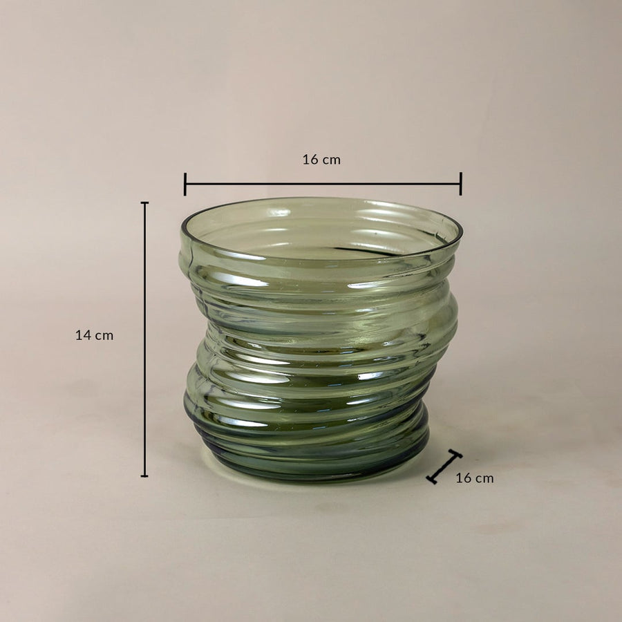 Green ribbed glass vase with a unique wavy structure measuring 14 cm tall and 16 cm wide displayed with dimensions.