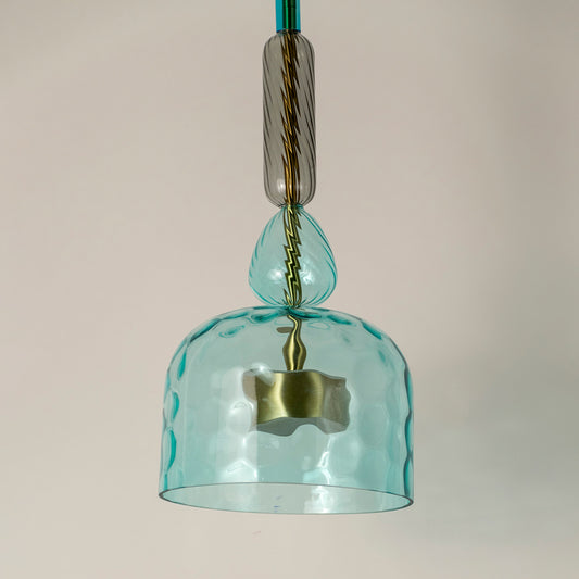 Closeup of turquoise textured glass pendant light with decorative details showcasing premium craftsmanship.