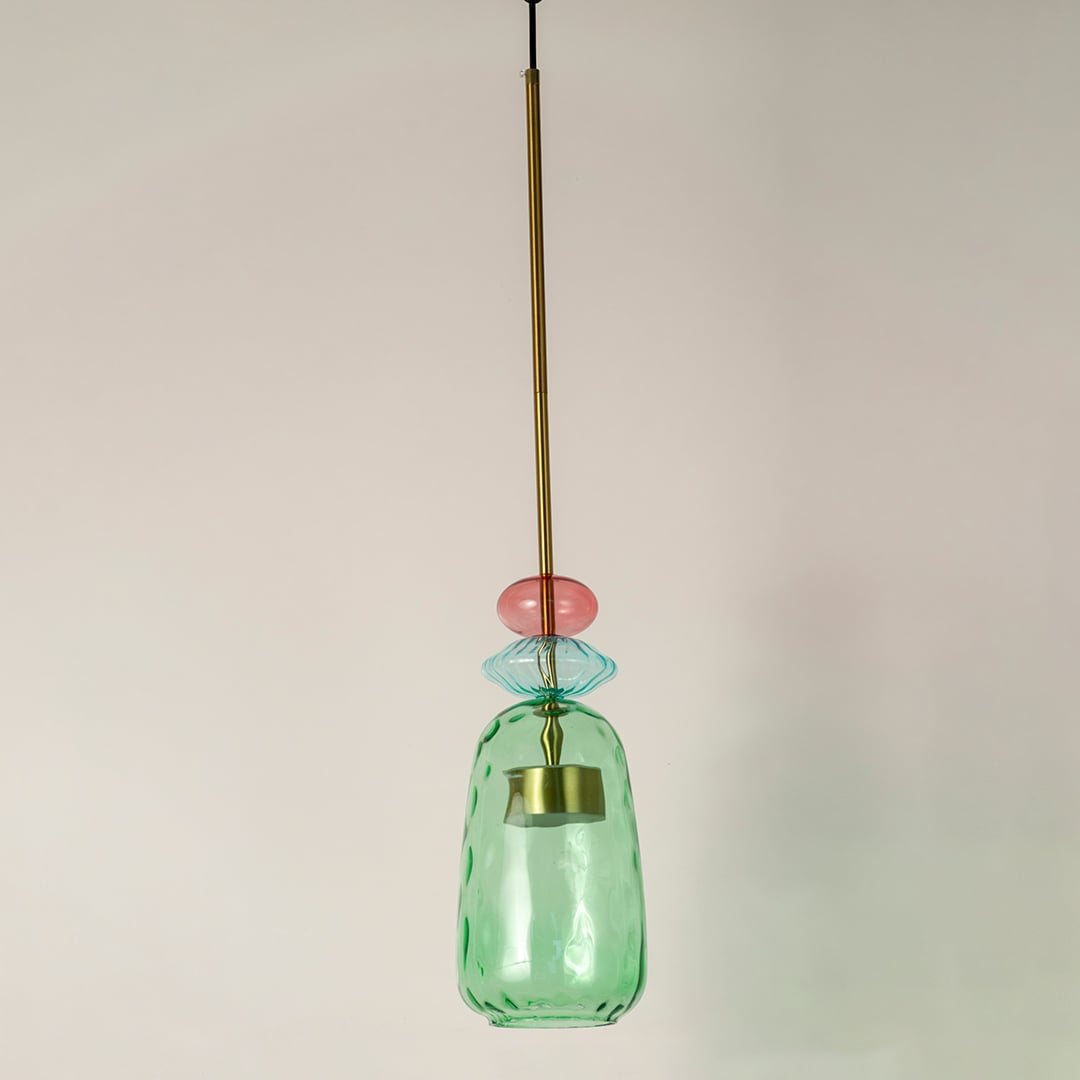 Mint green ribbed glass pendant light with coral accents crafted for stylish modern interiors.