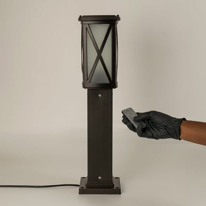 Black outdoor bollard light with remote control for smart exterior lighting and decor styling use.