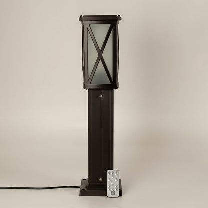 Black solar outdoor bollard light with frosted glass panels for modern exterior decor use.