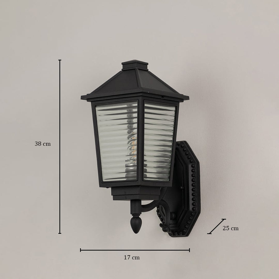 Traditional black outdoor wall lantern with ribbed glass measuring 38cm height 17cm width and 25cm projection bracket specifications.