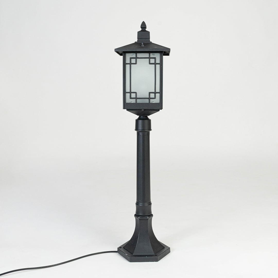 Black outdoor garden light with frosted glass panels for stylish exterior decor styling use.