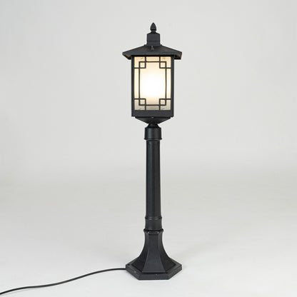 Vintage black outdoor garden light with warm glowing panels for elegant exterior decor styling use.