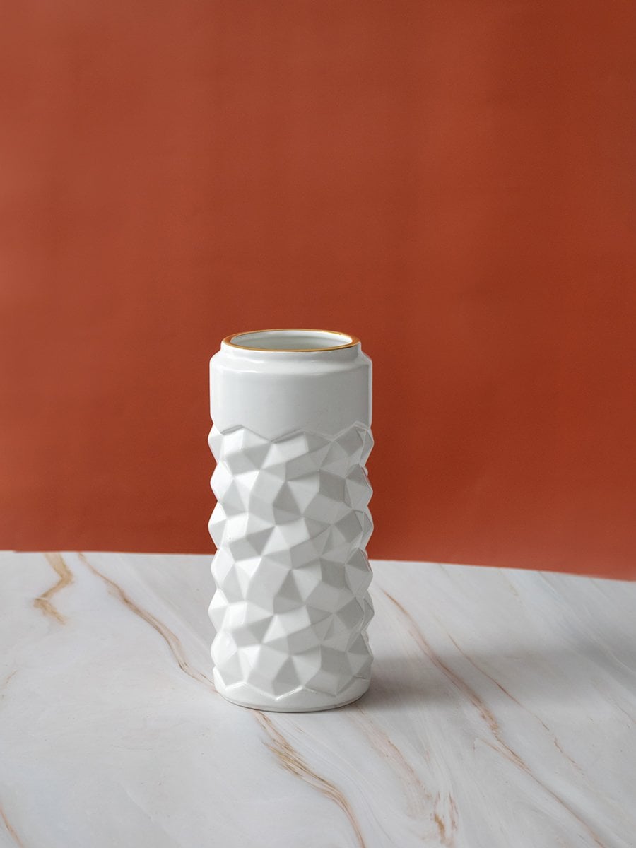White textured ceramic vase on plain background showcasing its modern geometric design and smooth finish for contemporary decor.