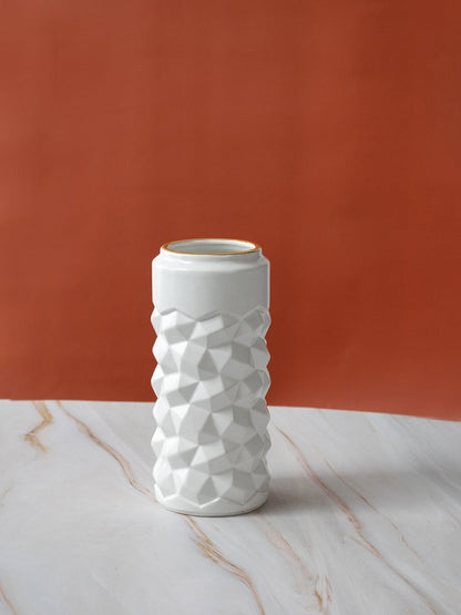 White textured ceramic vase on plain background showcasing its modern geometric design and smooth finish for contemporary decor.