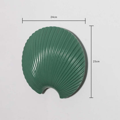 A decorative green shell wall plate displayed with measurements showing 24 cm width and 25 cm height for accurate reference of its sculpted design.