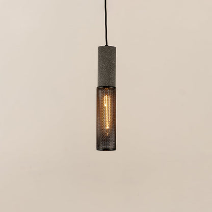 Black cylindrical metal pendant ceiling light with mesh detail illuminated softly against clean white background for interiors