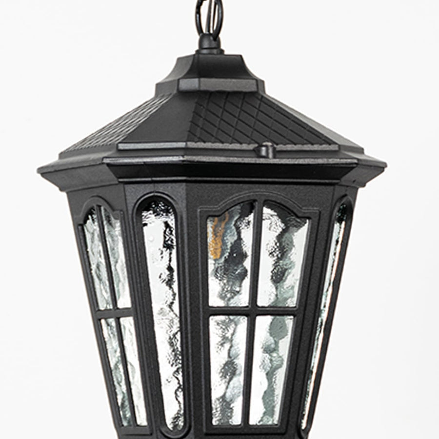 Closeup of hanging lantern light highlights textured glass panels and durable black frame designed for weather-resistant outdoor lighting.