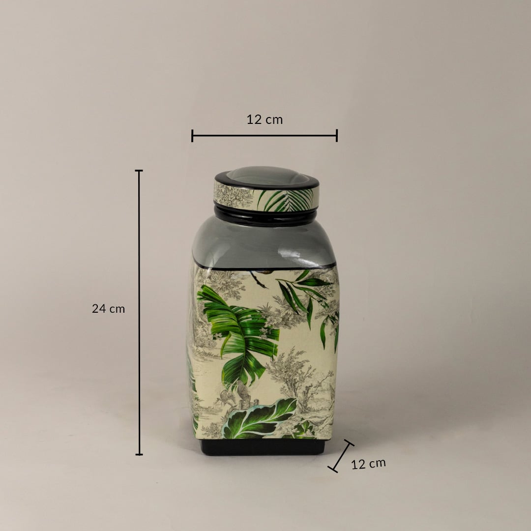 Tropical leaf jar measuring 24 cm tall and 12 cm wide with artistic tropical design.
