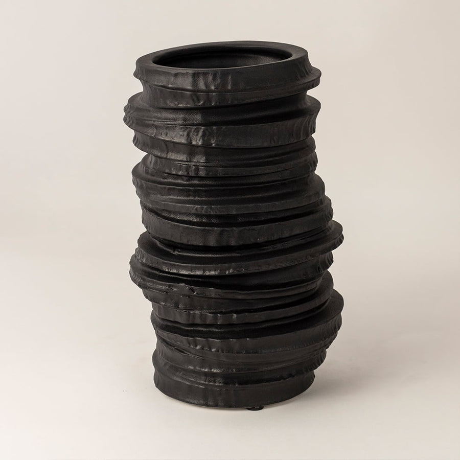 Aero black ceramic vase displayed on a white background showcasing its handcrafted stacked texture and matte finish for modern home styling.