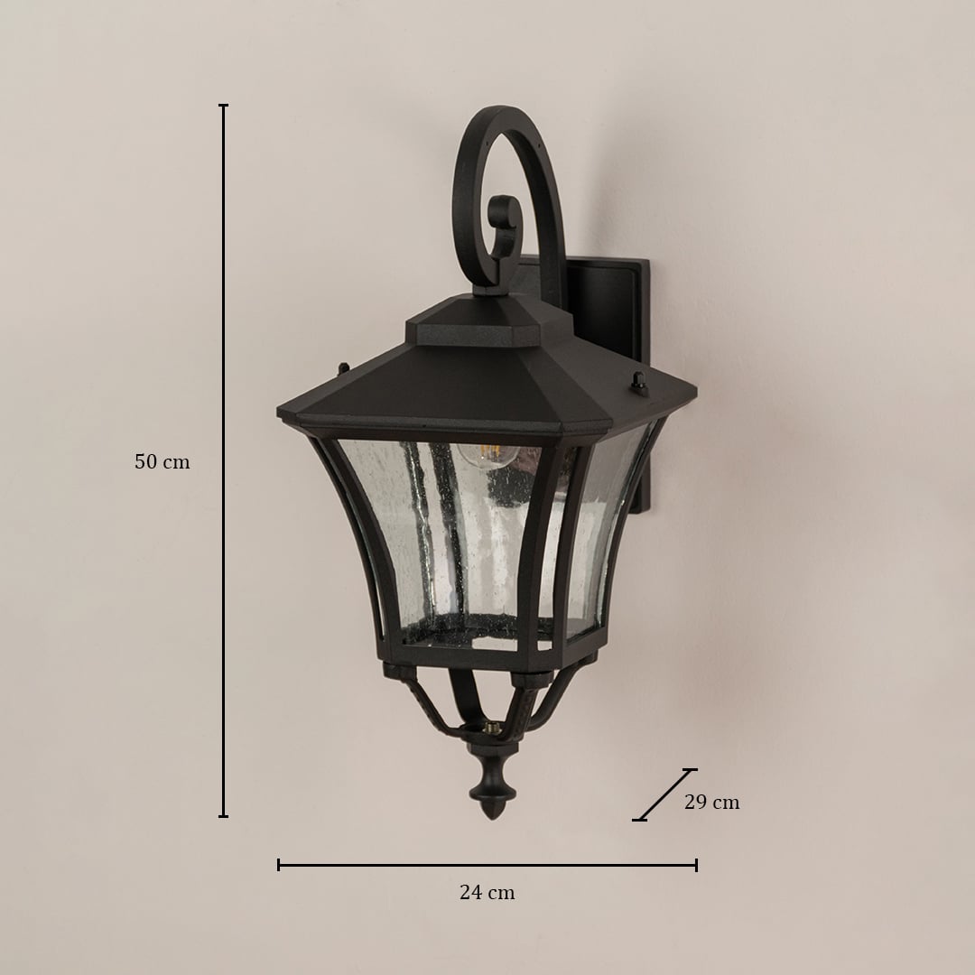 Black outdoor lantern with clear textured glass sized at 50 cm height 24 cm width and 29 cm depth for exterior walls.