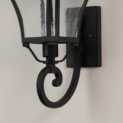 Close detailed view of black metal outdoor lantern with textured glass showing fine finish and premium outdoor design.