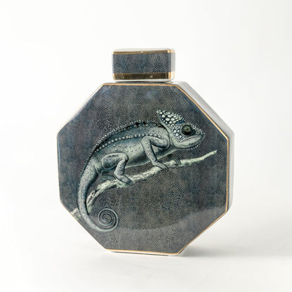 Octagon ceramic jar with detailed lizard artwork displayed on clean backdrop for rustic natural décor accents.