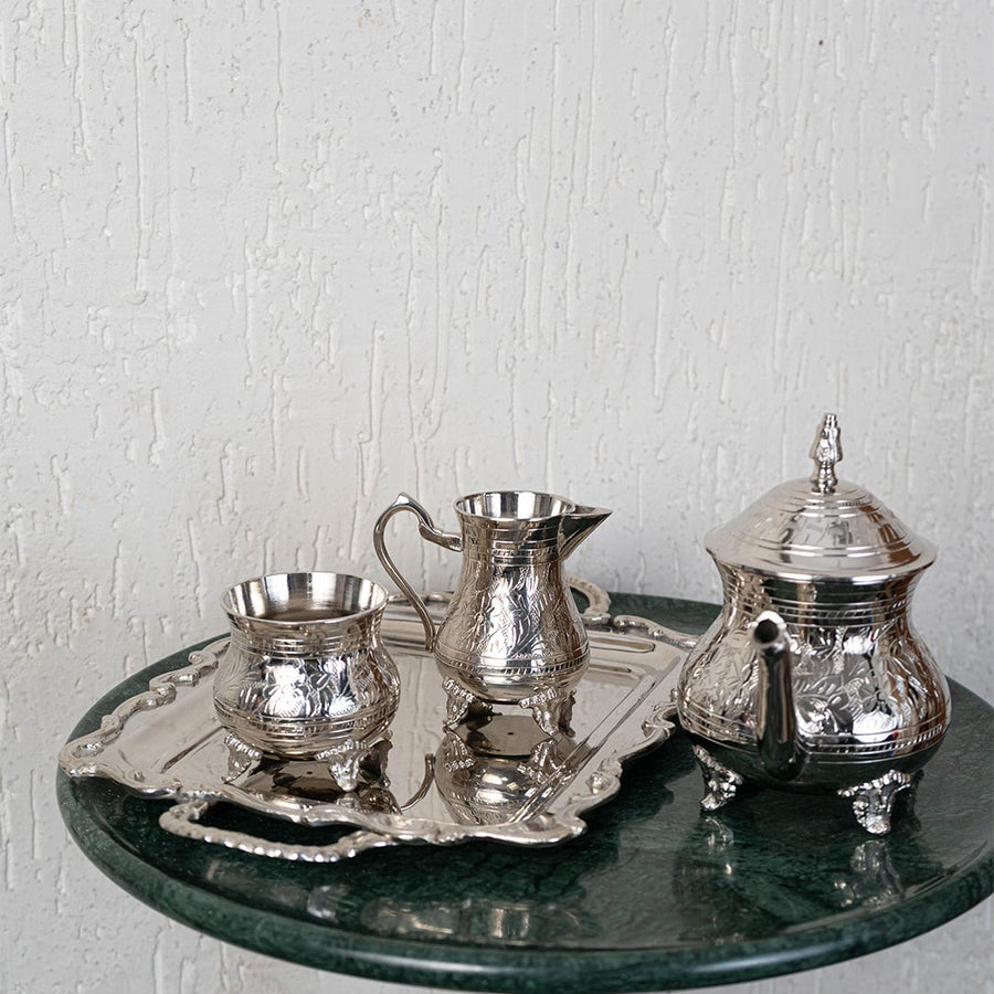 Main image of full silver tea set including tray kettle milk and sugar bowls with vintage finish and elegant detailing.