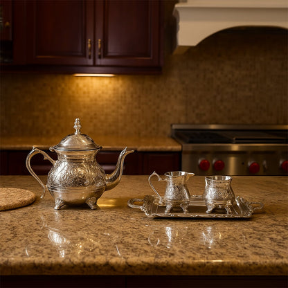Antique silver tea service set with teapot and creamer displayed on a wooden coffee table in a modern living room for home decor.