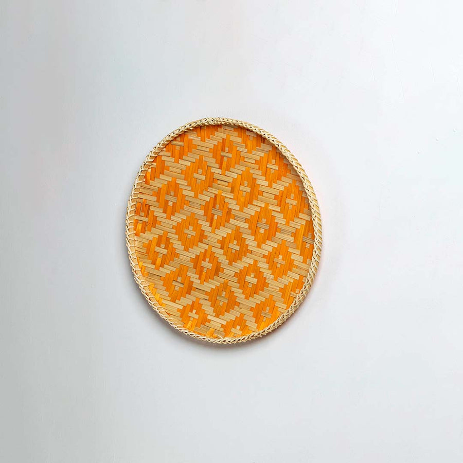Side view of round bamboo wall plate revealing its smooth rim  sturdy craftsmanship and balanced curvature for elegant wall styling.