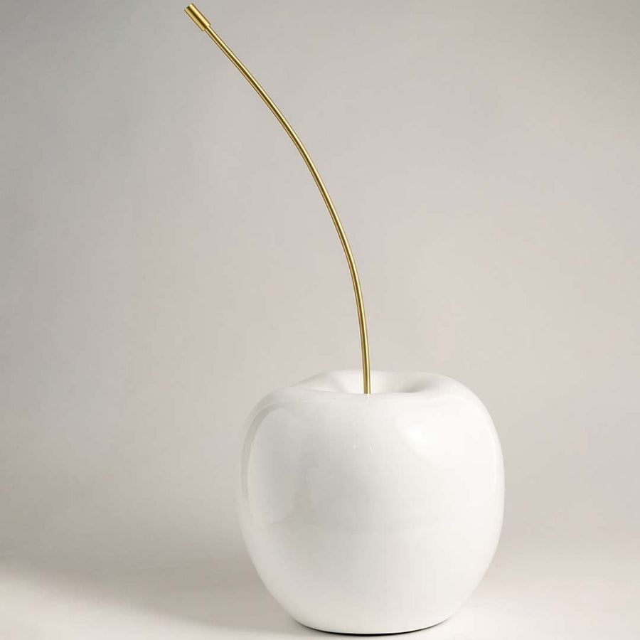 White cherry decor displayed on a bright white background emphasizing its smooth ceramic texture and luxurious gold metal stem.
