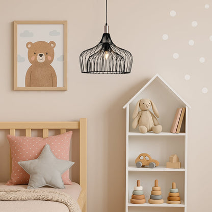 Black metal pendant light hanging in a soft pastel kids room with a wooden bed star cushion toy shelf and playful decor for a warm cozy look.