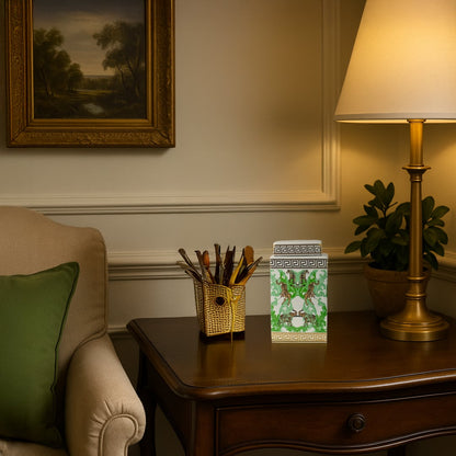 White ceramic jar with gold and green tiger design adding a luxurious accent to a classic wooden side table.