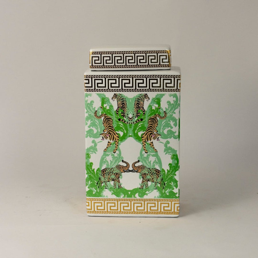 White ceramic jar against white background showcasing its glossy finish and intricate wildlife artwork.