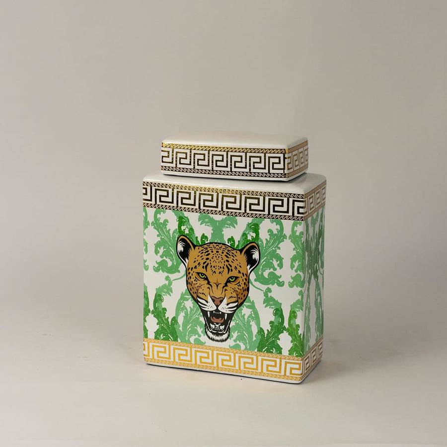 Side angle view of white ceramic jar showing gold-trimmed edges and detailed hand-painted leopard artwork.