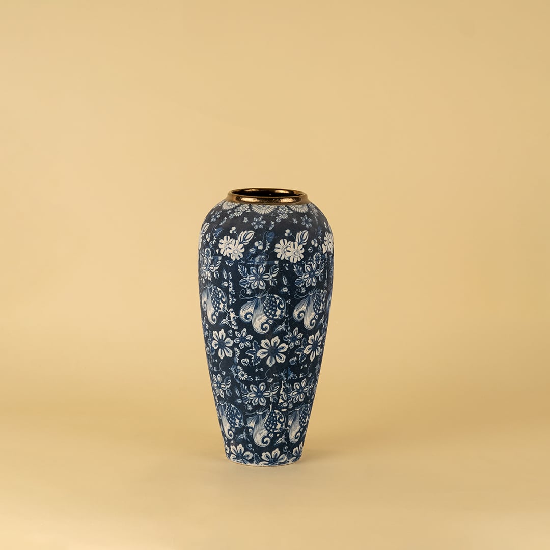 Blue floral ceramic vase with golden rim ideal for enhancing home interiors and modern decorative accents.