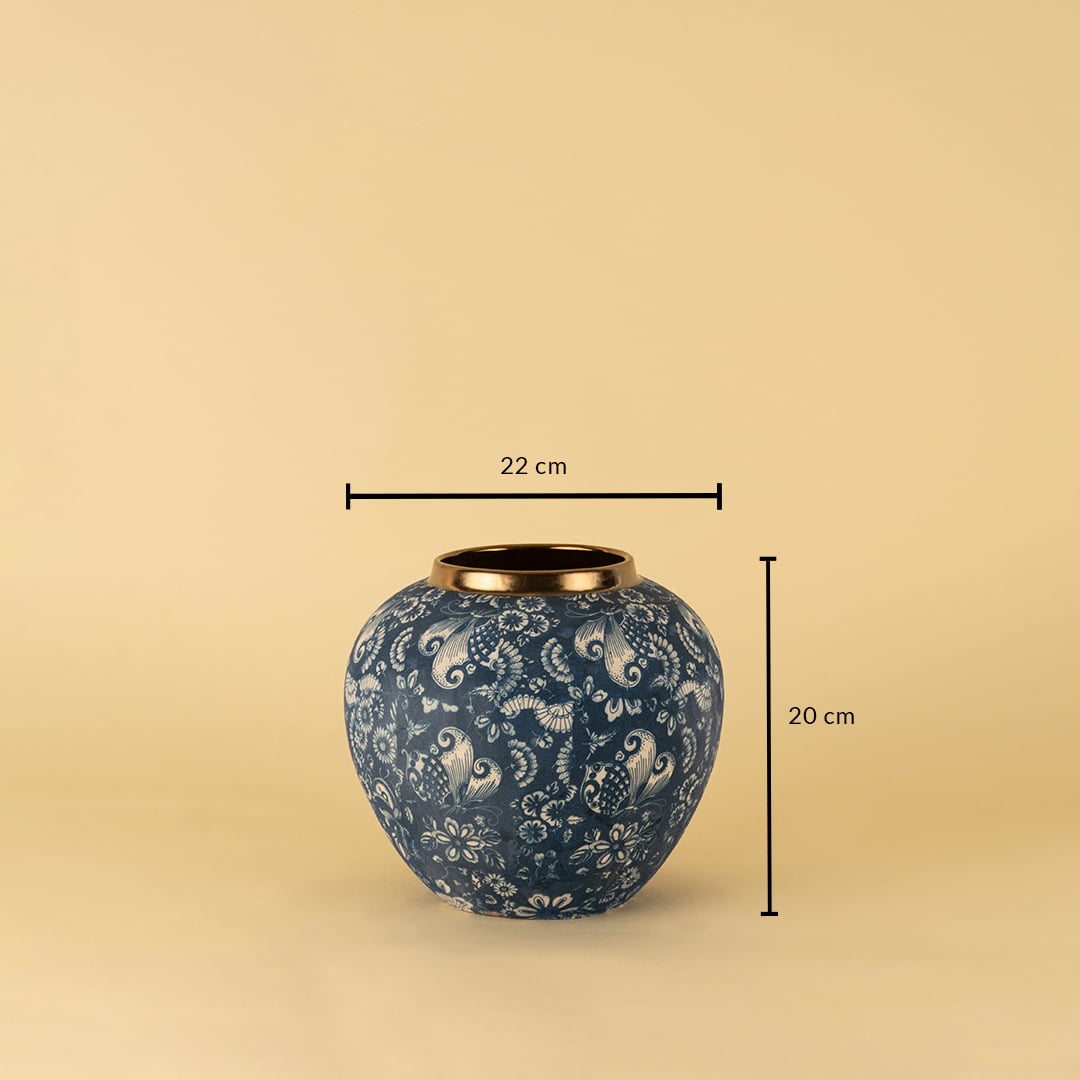 Blue ceramic vase with golden rim shown on beige background measuring 20cm height and 22cm width in floral paisley design.