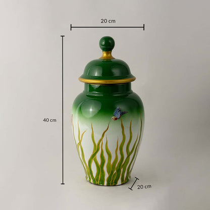 Green ceramic jar with golden rim and butterfly art shown with 40 cm height and 20 cm width for size reference.