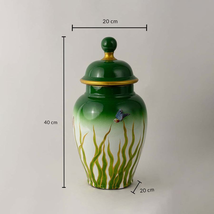 Green ceramic jar with golden rim and butterfly art shown with 40 cm height and 20 cm width for size reference.