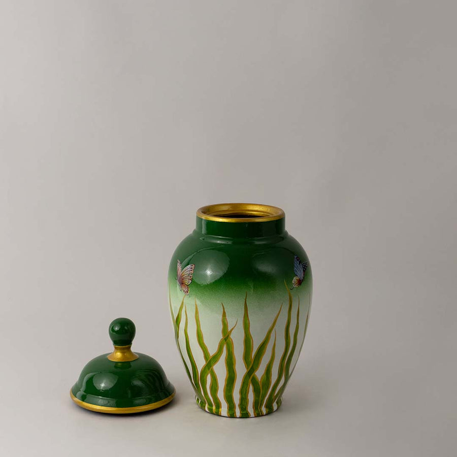 Luxury ceramic decor jar with glossy green finish and butterfly artwork perfect for home and tabletop styling.