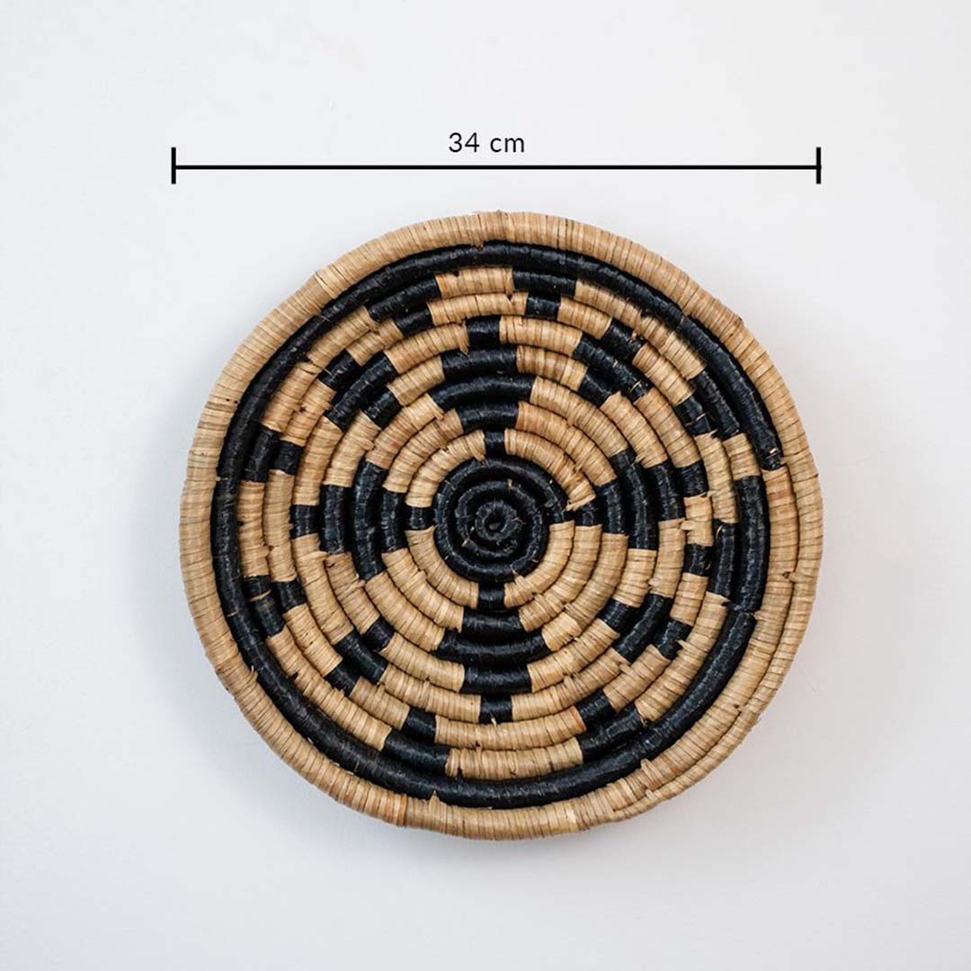Eco friendly wicker wall decor basket in beige and black pattern with 25 cm diameter for modern interiors.