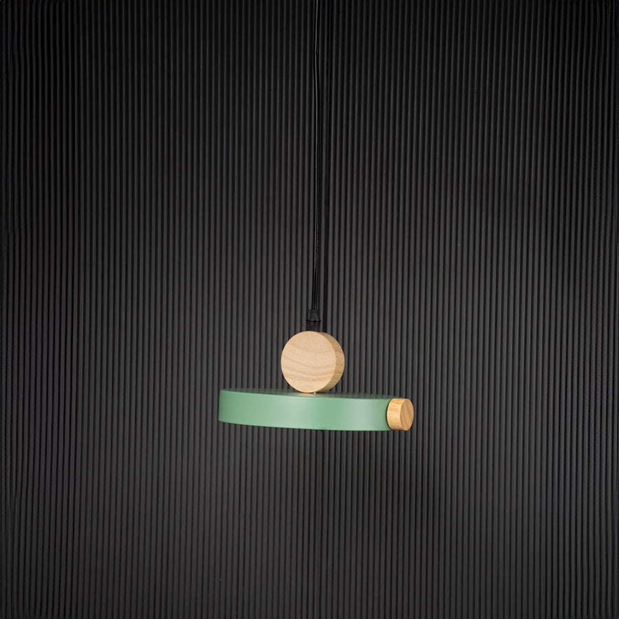 Green wood and metal pendant light bulb off on black background with circular round design for stylish interiors.