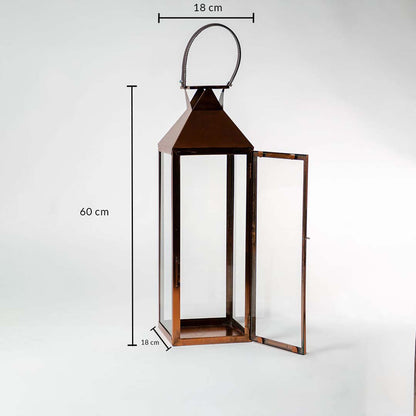 Brown metal lantern with clear glass measuring 60 cm height and 18 cm width perfect for home and garden decor accents.