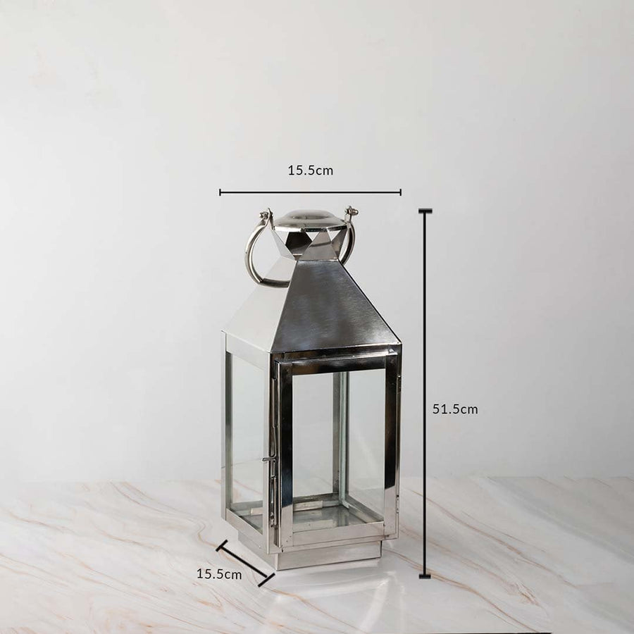 Tall silver lantern dimensions 51.5cm height and 15.5cm width with stainless steel body and glass sides.