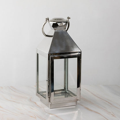 Stainless steel lantern turned off displayed plain on white background highlighting polished finish.