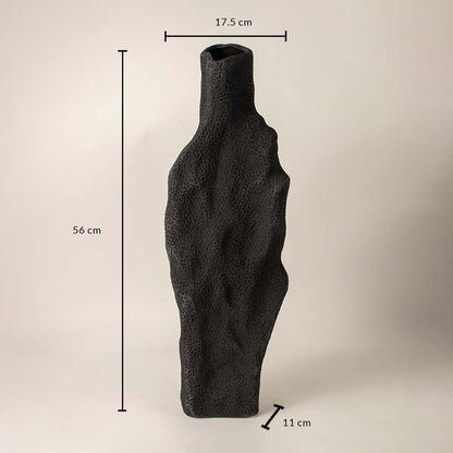 Black textured ceramic vase measuring 56 cm height 17.5 cm width and 11 cm depth displayed on white background.