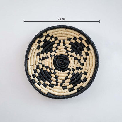 Round handcrafted wall basket in black and beige tones showing approx 28 cm diameter ideal for accent wall decor use.