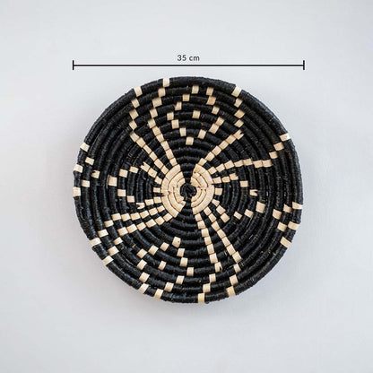 Black pattern wall basket measuring 35 cm in diameter displayed on white wall to show size and detailing.