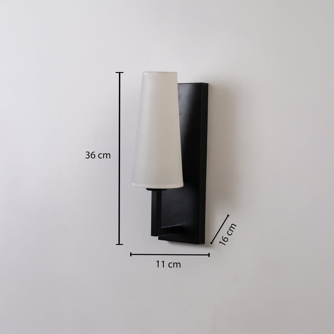 Black metal wall light with tall white fabric shade shown with 36 cm height 11 cm width and 16 cm depth for accurate indoor wall placement.