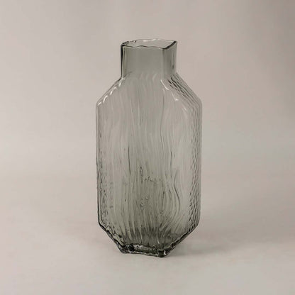Side view of tall smoky gray glass vase showcasing its elegant textured pattern and refined modern form.