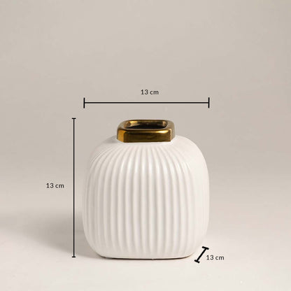 White ceramic ribbed vase with gold rim measuring 13 cm height and 13 cm width ideal for small table décor.