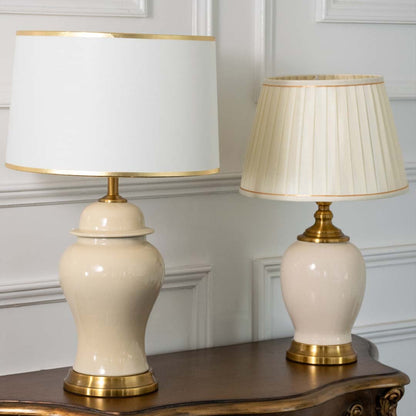 Jarro ceramic table lamps turned off grouped with white and pleated shades featuring gold bases perfect for luxury home decoration.