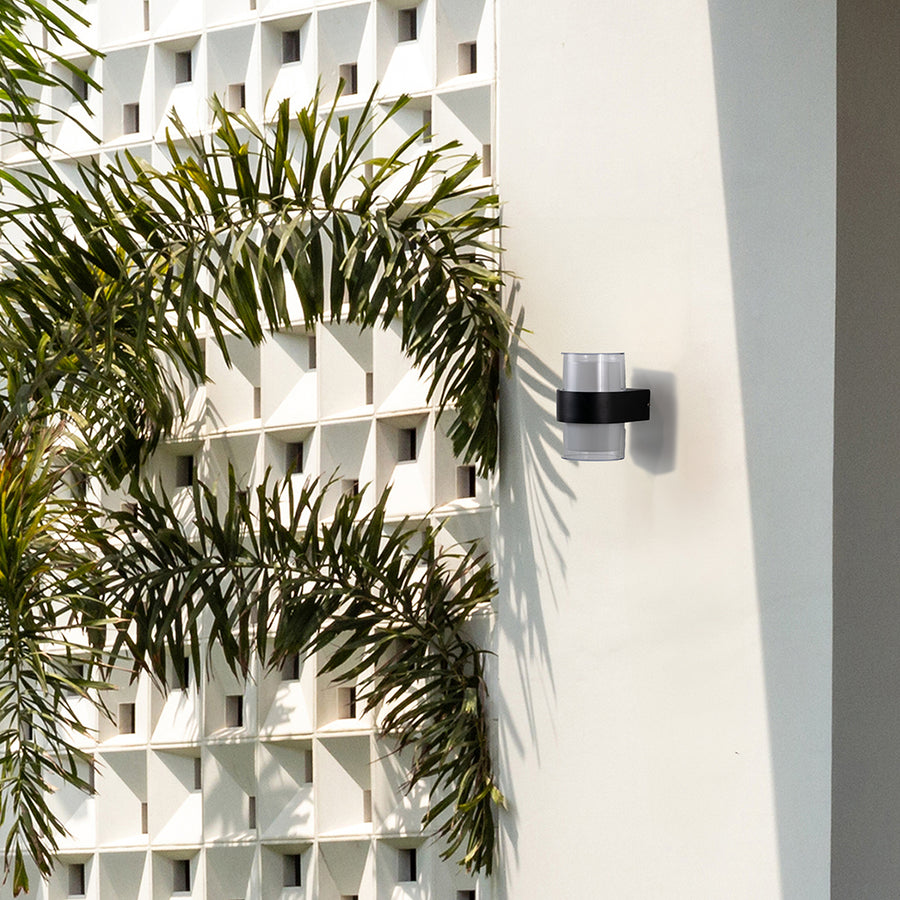 Stylish black and white wall light mounted on wall enhancing modern interiors with functional design and diffused soft glow.