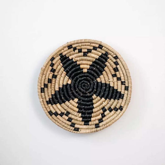 Black and natural handcrafted woven wall basket with bold star pattern for modern wall styling and home decor.