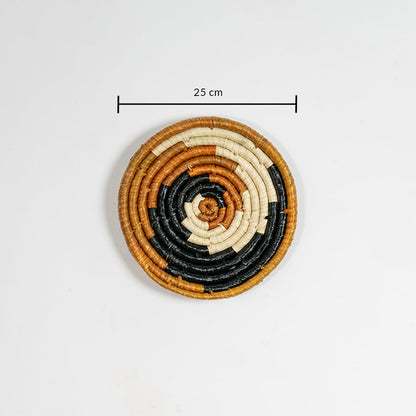 Handwoven jute round wall basket decor in beige black and brown rustic boho spiral wall art piece with 25 cm size shown.
